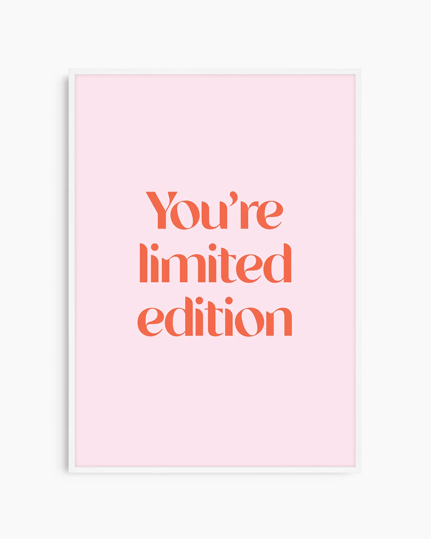 Children's poster with red text 'You're limited edition' on a pink background framed in a white frame.