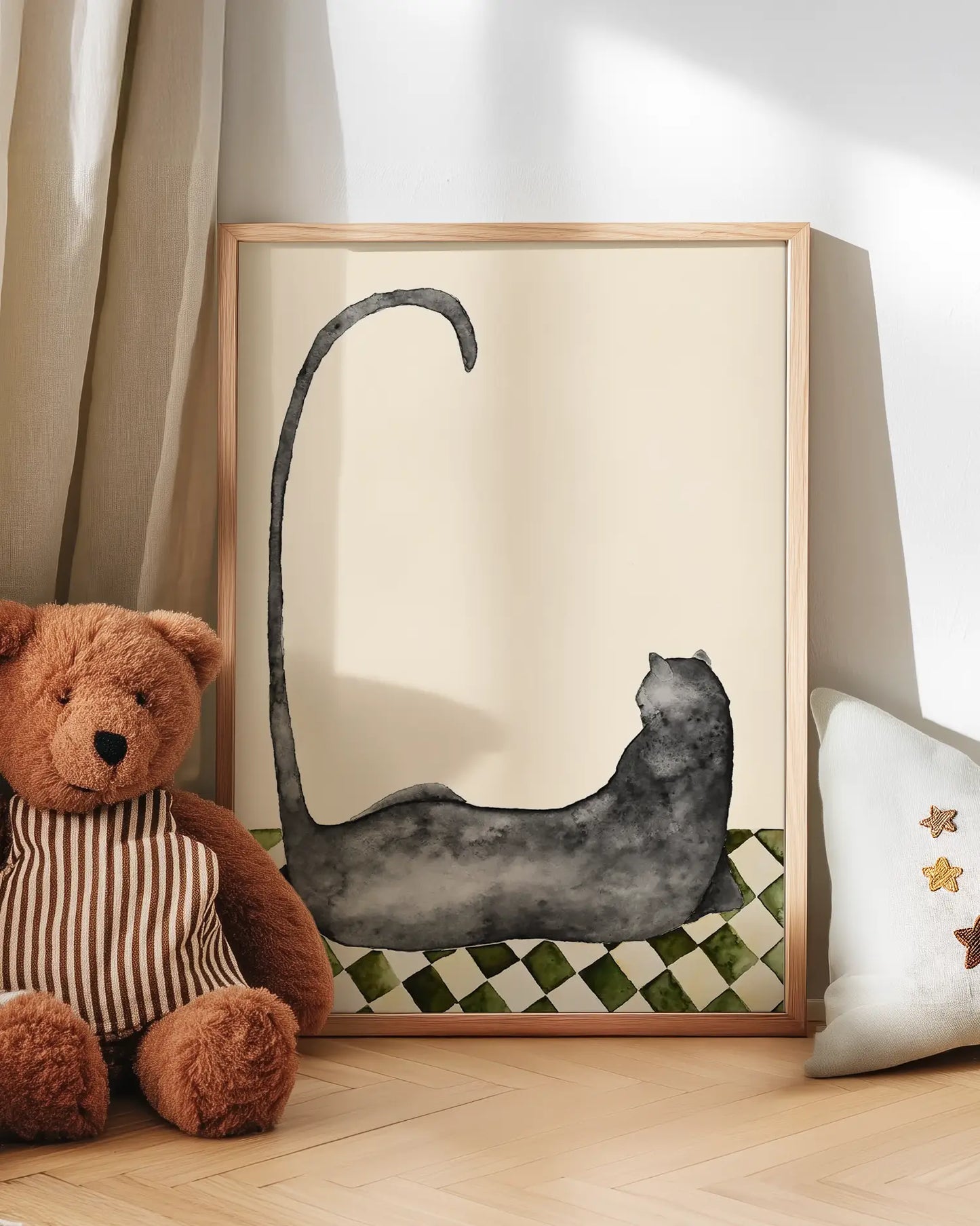 Artwork of a black panther on a checkered background next to a teddy bear and decorative pillow.