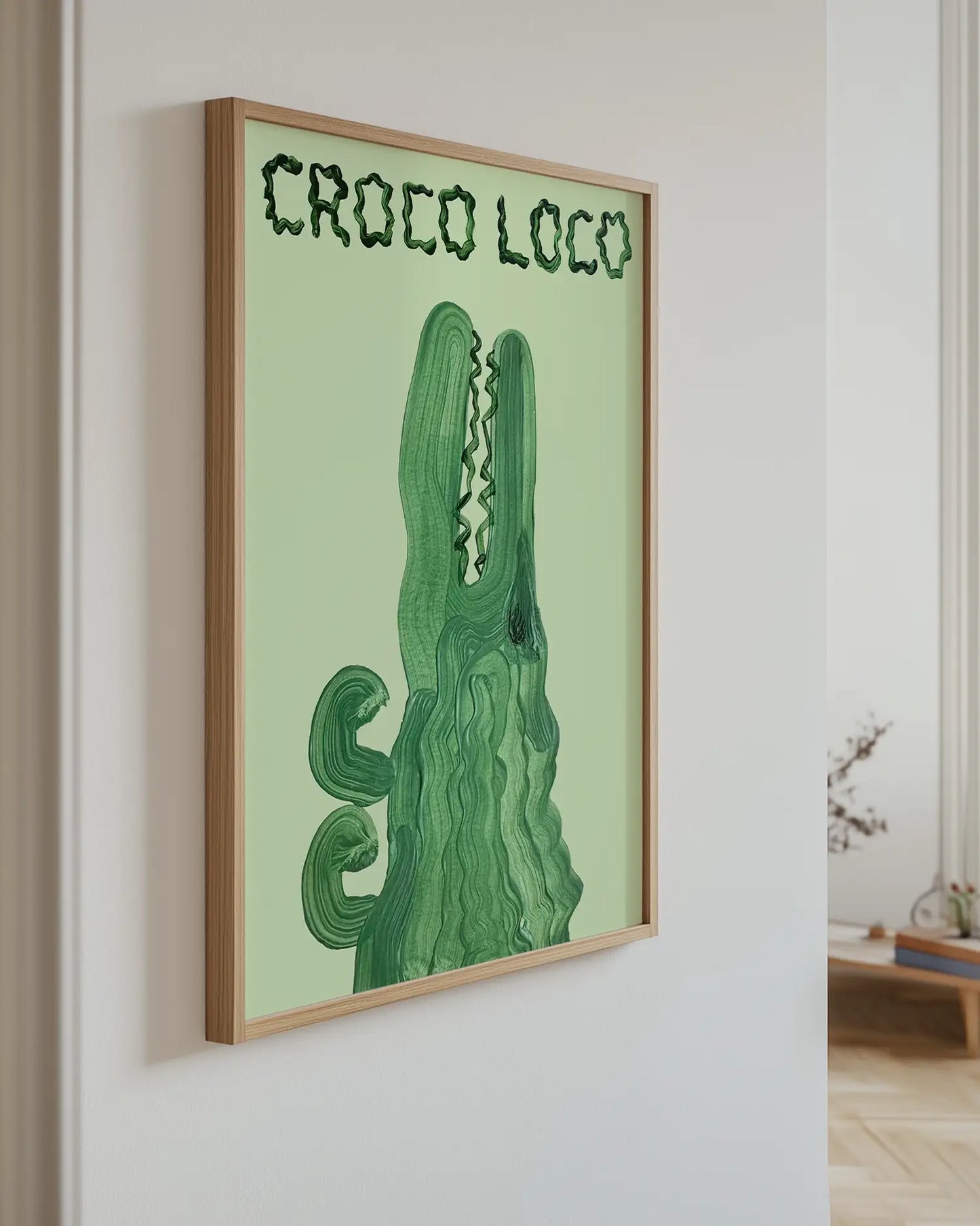 Artwork of a green crocodile with 'CROCO LOCO' text on a light green background.