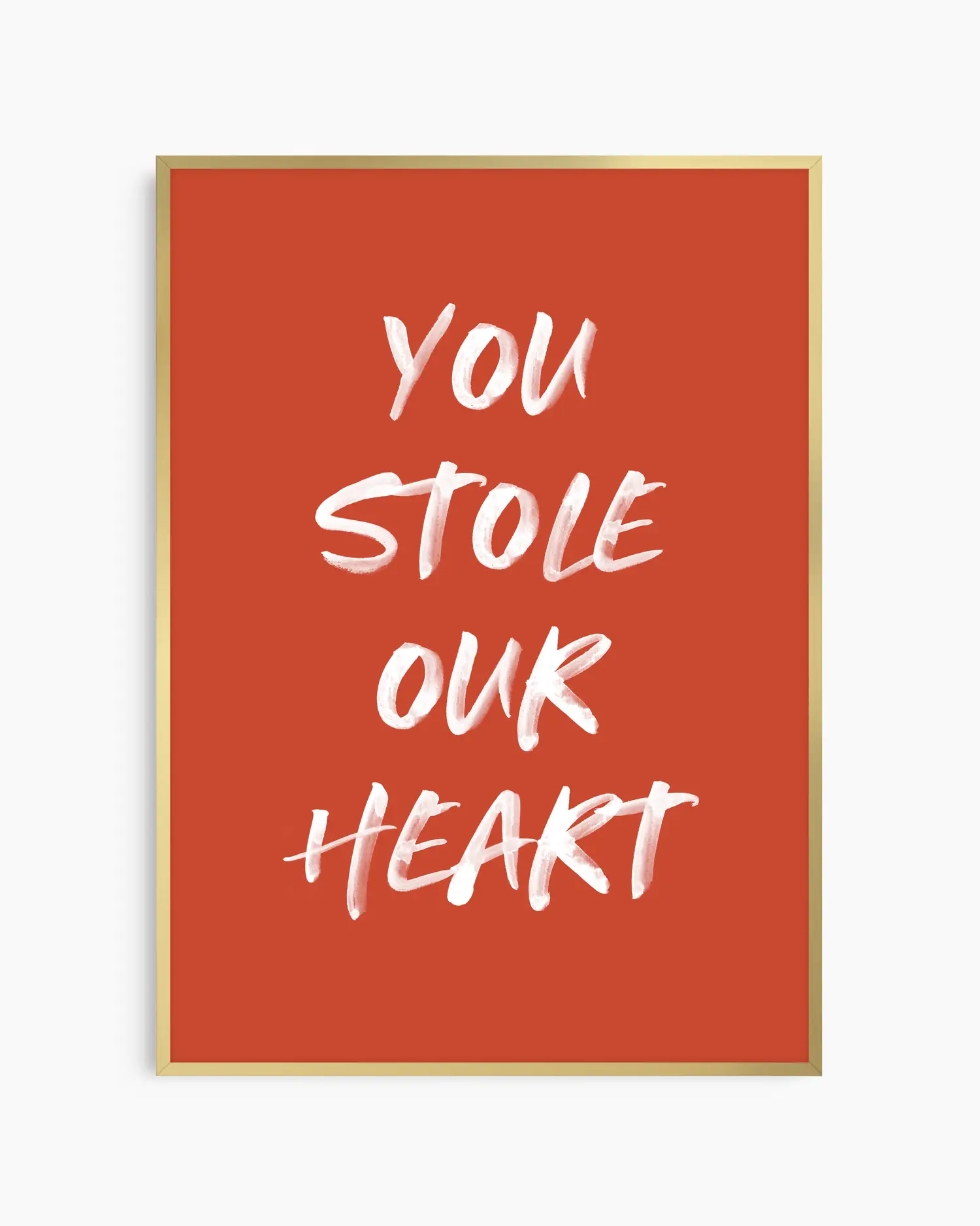 Nursery poster with white text 'You stole our heart' on a red background. Gold frame.