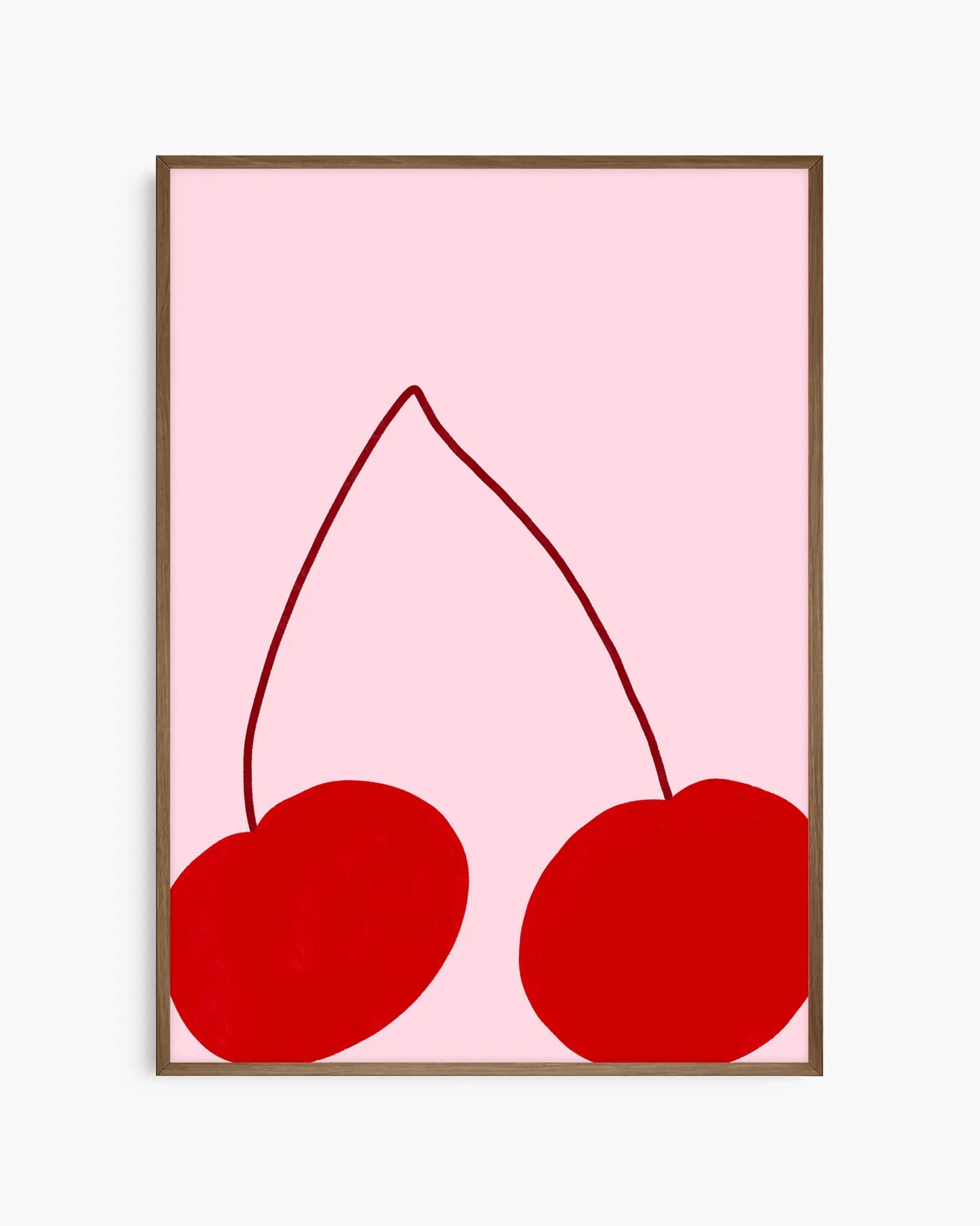 Framed artwork of two red cherries on a pink background