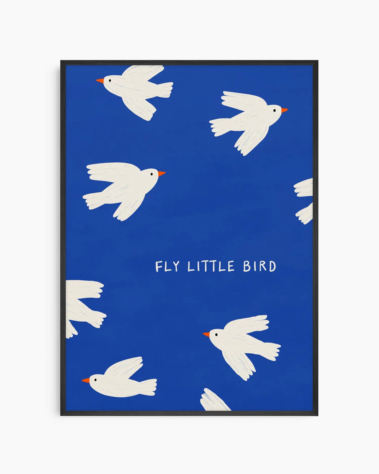 Framed artwork with white birds and 'Fly Little Bird' text on a blue background