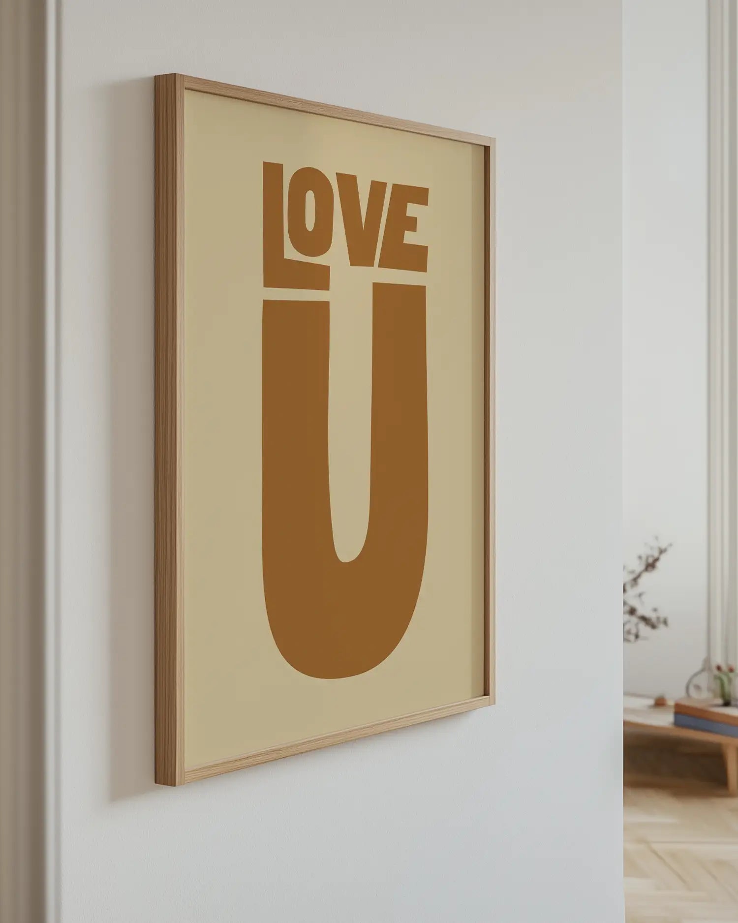 Framed artwork with 'LOVE U' text on a beige background