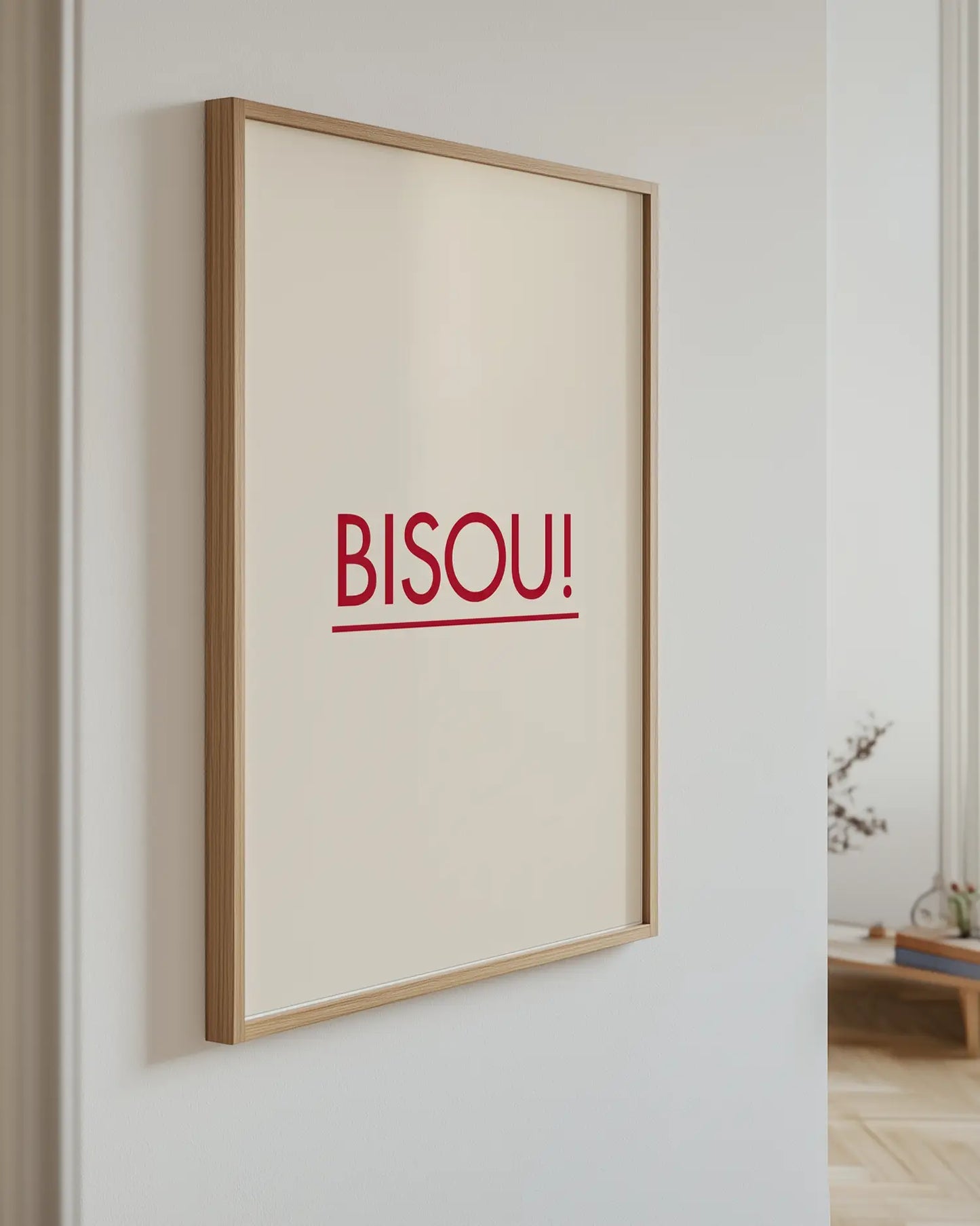 Poster with the text "BISOU!" on the wall