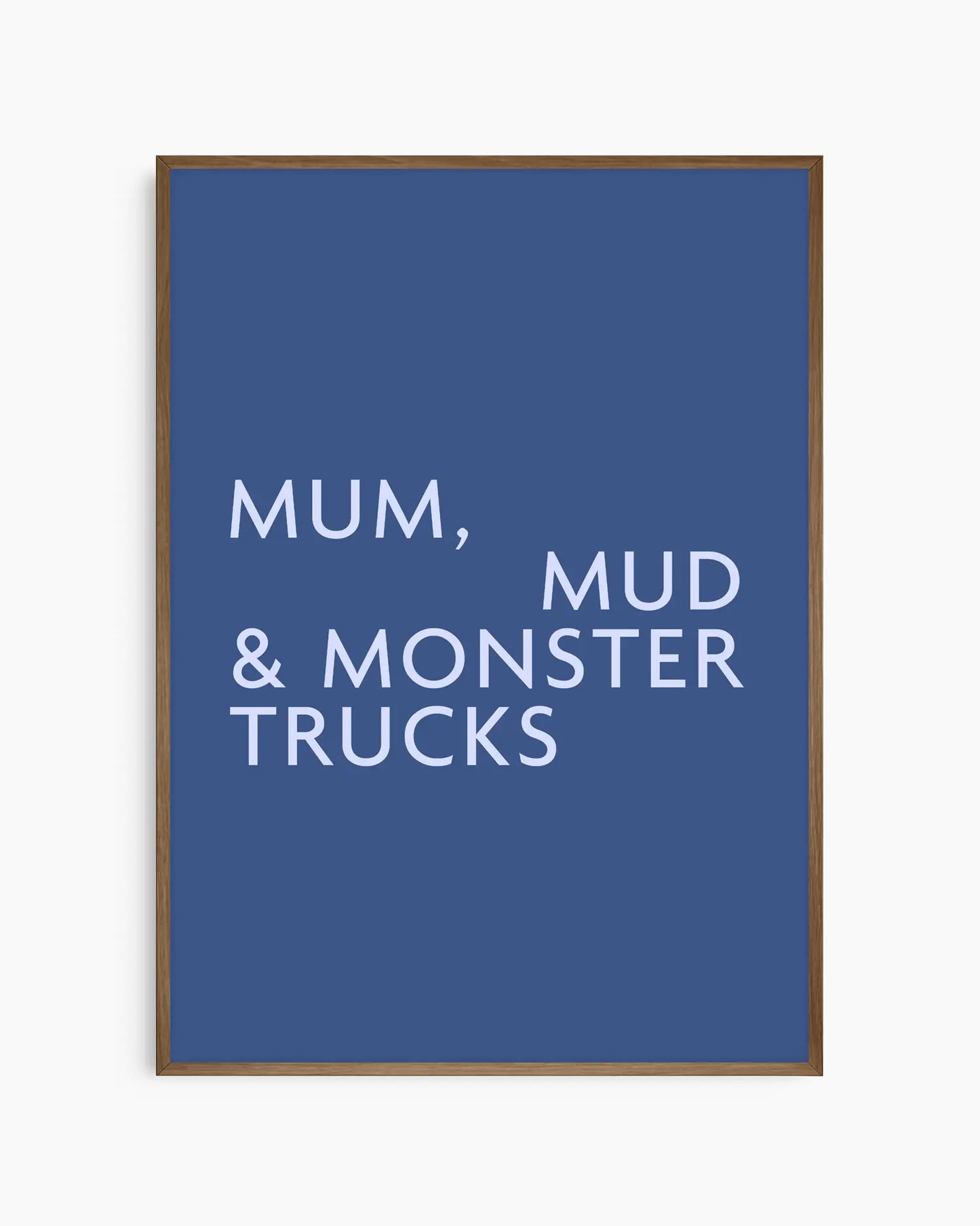 Poster with light blue text 'MUM, MUD & MONSTER TRUCKS' on a dark blue background in a smoked oak wooden frame.
