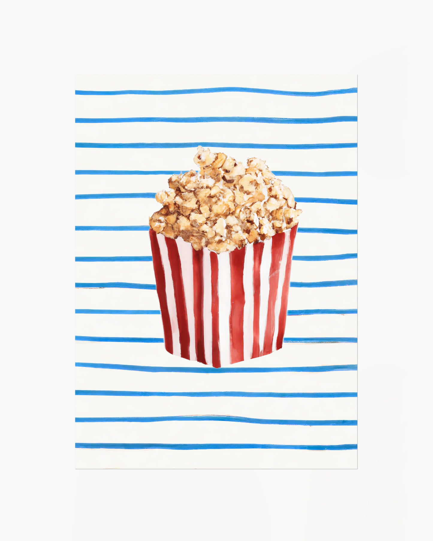 Popcorn in a red and white striped bucket on a white background with blue stripes