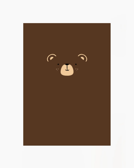 Brown notebook with a bear face design on a white background