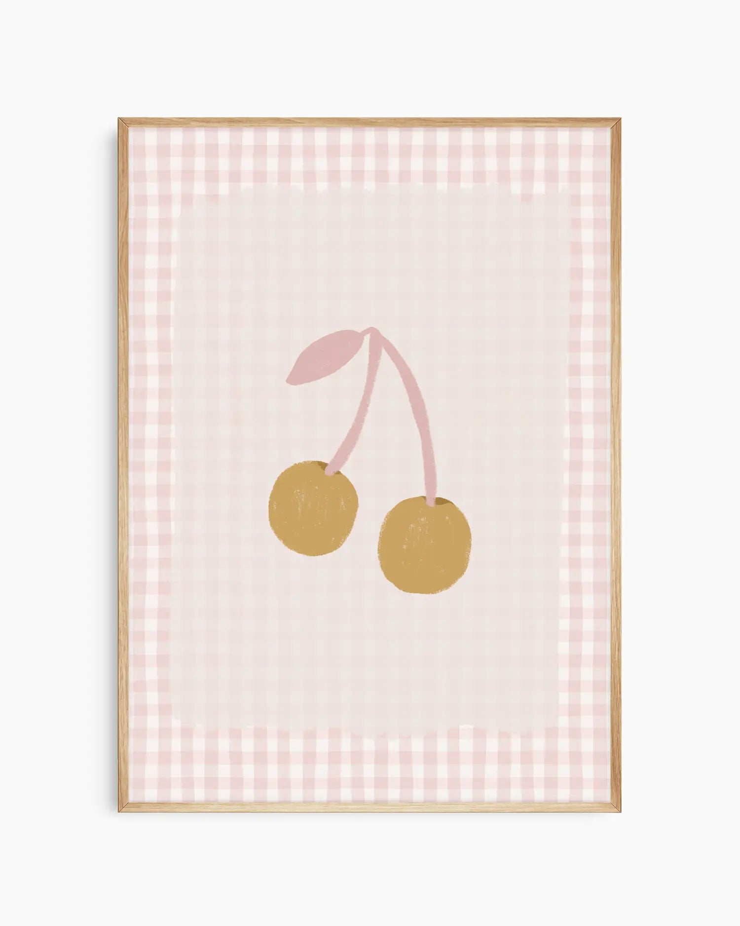 Framed artwork with two gold cherries on a pink checkered background