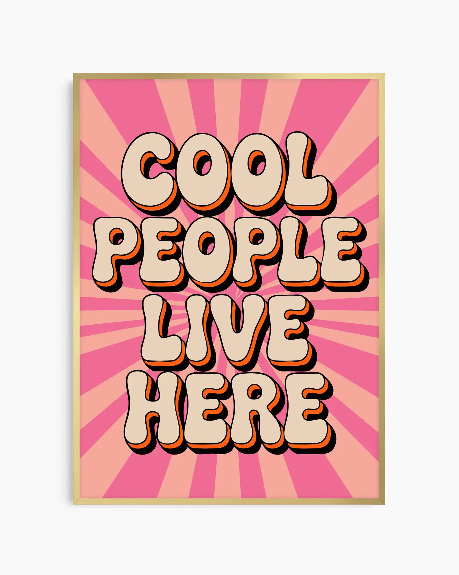 Nursery poster with 'Cool People Live Here' text on a pink sunburst background framed in a golden aluminium frame.