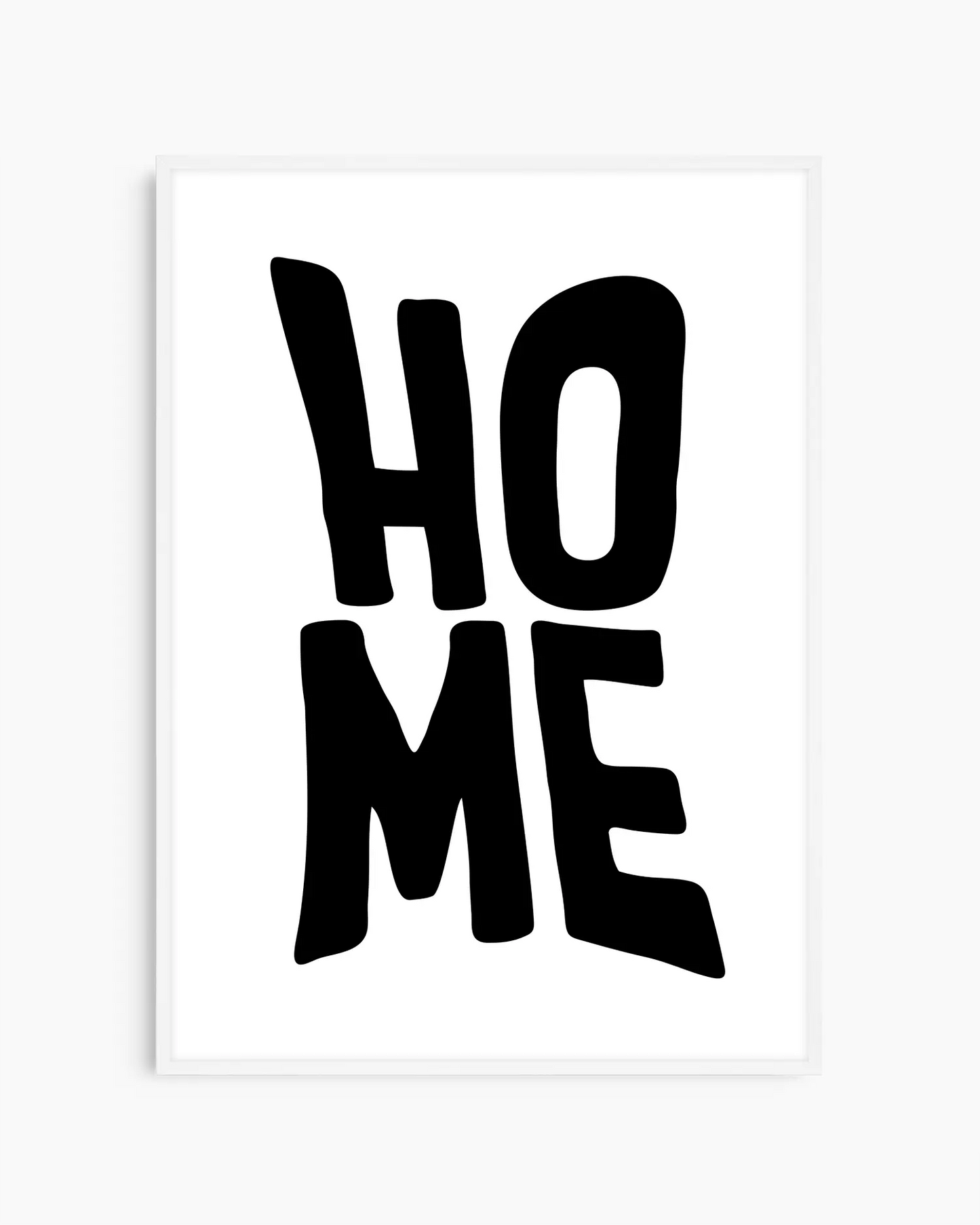 Framed artwork with 'HOME' text on a white background in a white wooden frame.