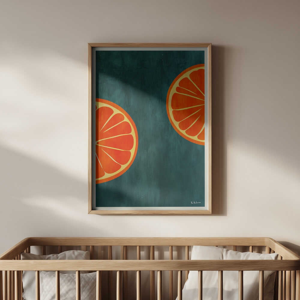 Bright and modern citrus art print featuring orange slices in a light wooden frame, hanging above a baby’s crib. A joyful and colorful wall decor piece that adds warmth and positivity to a modern nursery.