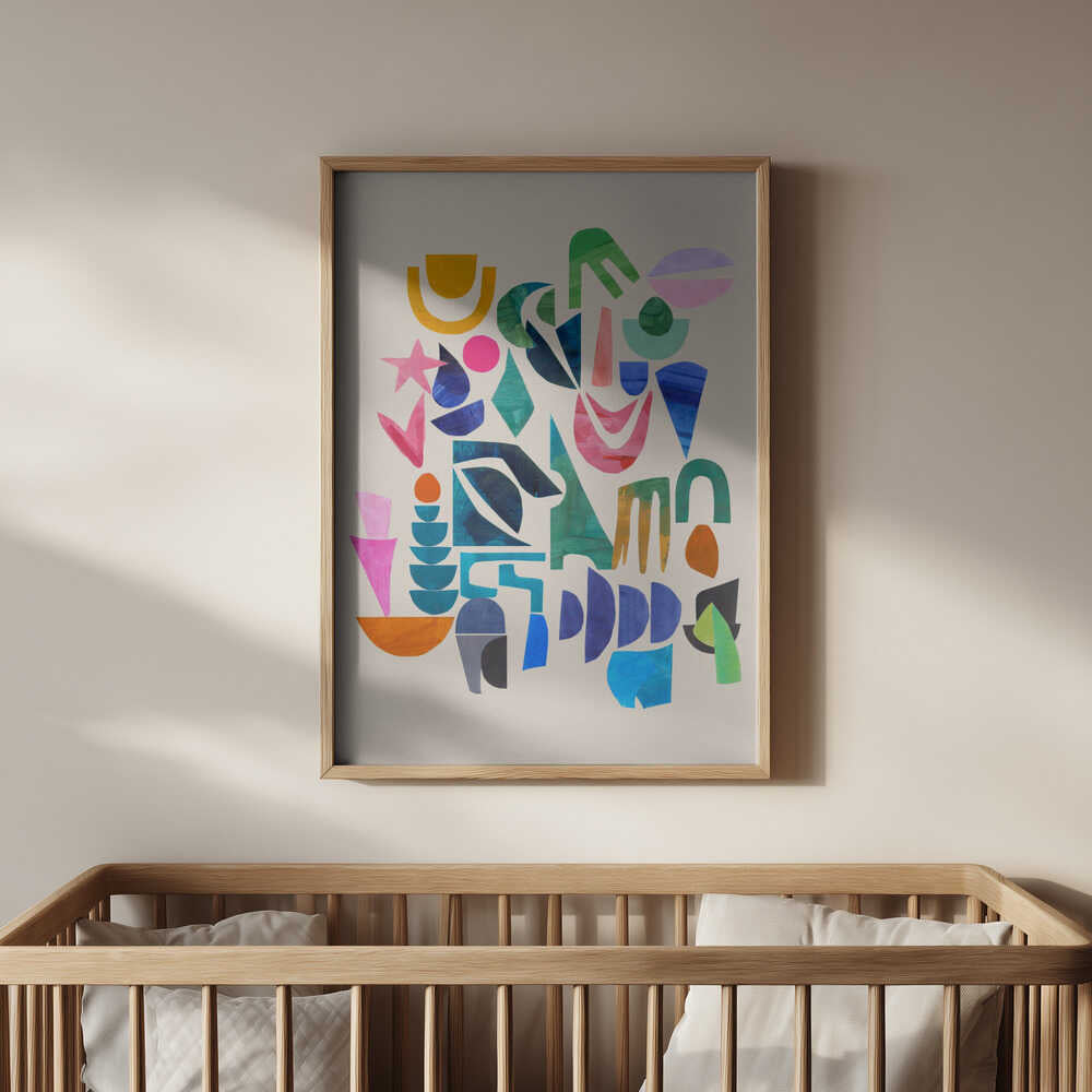 Vibrant abstract art print with colorful geometric shapes in a light wooden frame, hanging above a baby’s crib. Perfect nursery wall art that brings joy, color, and a modern artistic touch to any baby room.