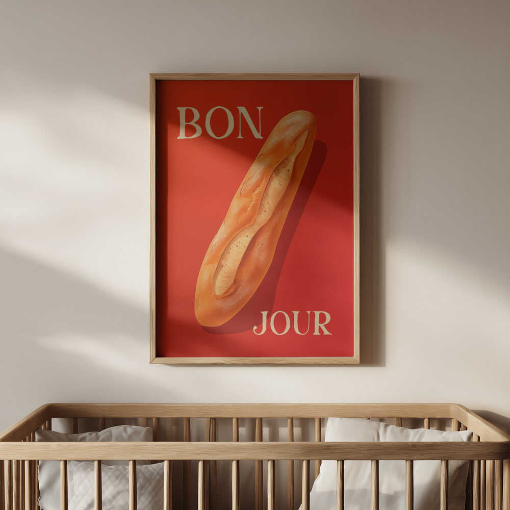 Framed poster with a baguette on a red background and the text 'BONJOUR' written on it hanging on the wall in the nursery.